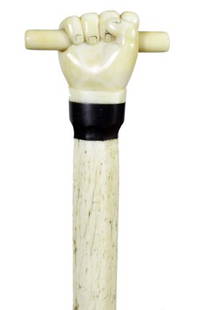 6. Nautical Whalebone Cane-Ca. 1850-A carved ivory: 6. Nautical Whalebone Cane-Ca. 1850-A carved ivory hand and baton (whale’s tooth), carved baleen collar, six sided to round shaft and no ferrule-H. 2 ½” x 1 ½”, O.L. 34”