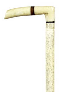 8. Nautical Whalebone Cane-Mid 19th Century-A cared: 8. Nautical Whalebone Cane-Mid 19th Century-A cared walrus ivory handle with an exotic wood insert, baleen collar, 5/8” whalebone shaft and a copper ferrule-H. 4” x 1 ¼”, O.L. 33”