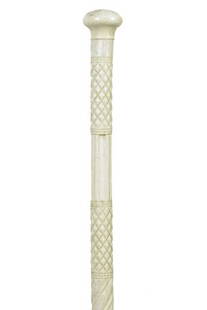 13. Architectural Whalebone Cane-Ca. 1840-Small whale’s: 13. Architectural Whalebone Cane-Ca. 1840-Small whale’s tooth handle fully carved whalebone shaft with spirals, diamonds and columns and no ferrule-H. 1 ½” x 1”, O.L. 36 ½”