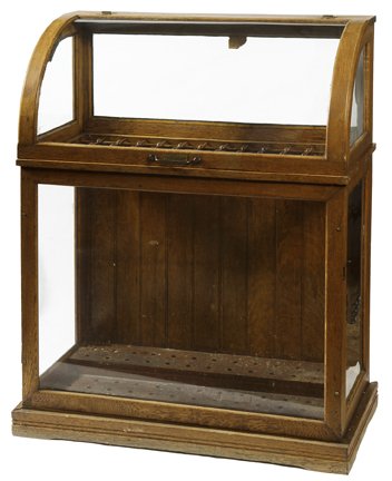 193. Oak Cane Case-Ca. 1890- Original Oak cane display: 193. Oak Cane Case-Ca. 1890- Original Oak cane display case with original glass, 78 spaces, stick and ball separations, stepped bottom, front lift top, brass hinges. 46 x36x19