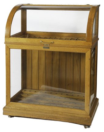 194. Oak Cane Case- Ca. 1890- Golden oak original: 194. Oak Cane Case- Ca. 1890- Golden oak original finish cane display case, lift top front and stepped bottom,78 spaces stick and ball separations, brass hinges, Plex curved glass top replaced. 48 x 3