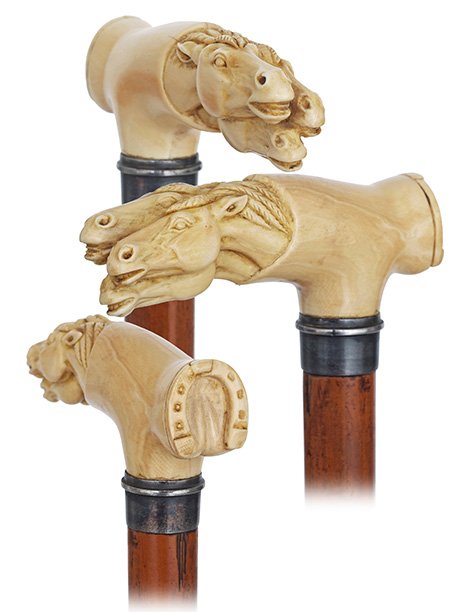 56. Ivory Three Stallion Heads Cane -Ca. 1890-Large: 56. Ivory Three Stallion Heads Cane -Ca. 1890-Large Opera shaped ivory handle carved with three stallion heads at the front and a hoof at the back. The stretching shape of the horse heads and the trea