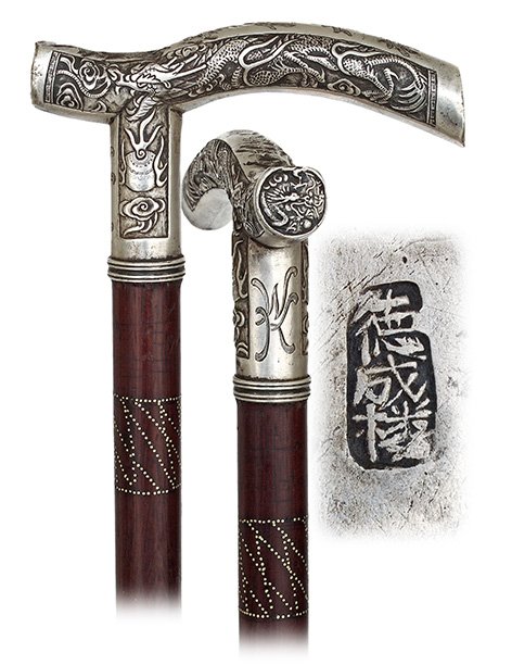 89. Chinese Export Silver Dragon Cane-Ca. 1900-Opera: 89. Chinese Export Silver Dragon Cane-Ca. 1900-Opera shaped silver handle well and densely hand chased and engraved with a dragon panel on each side and a third, smaller and round one en suite on the 
