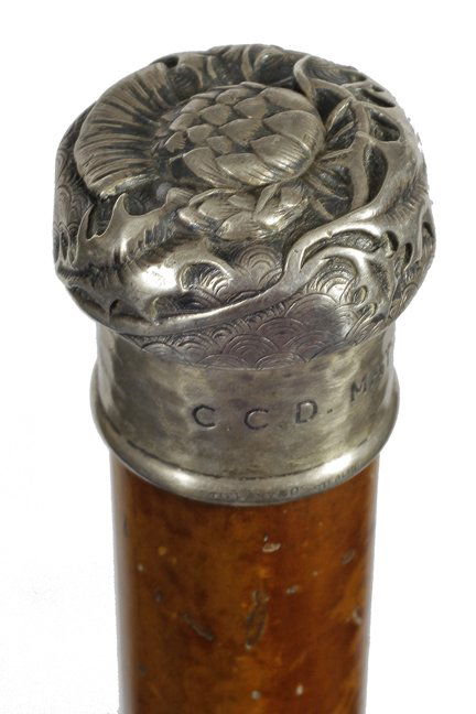 109. Tiffany Dress Cane-Dated 1885-A signed sterling: 109. Tiffany Dress Cane-Dated 1885-A signed sterling handle with a blooming thistle in high relief atop which is surrounded by leafs and thorns, a hammered lower part with the inscription “C. C. D.
