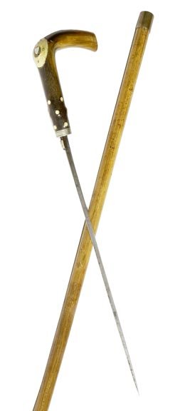 137. Sword Cane-Ca. 1870-A horn handle with a bone and: 137. Sword Cane-Ca. 1870-A horn handle with a bone and silver shield cartouche, push button working mechanism, 10 ½” etched blade, bell bronze collar signed “4,200”, malacca shaft and a 2” br