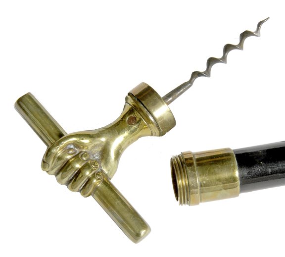 153. Corkscrew Dress Cane-Ca. 1900-A corkscrew cane: 153. Corkscrew Dress Cane-Ca. 1900-A corkscrew cane which also doubles as a bludgeon cane due to the weight of the handle, 3 ½” corkscrew, thick ebony shaft and a metal ferrule-H. 4” x 3”, O.L.