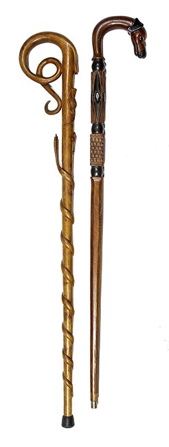 40. Johnny Winter Canes- 20th Century- A pair of carved: 40. Johnny Winter Canes- 20th Century- A pair of carved folk art canes, one with a dog and the other with a swirl snake. AL- 36” $300-$400 NOTE:The first 55 lots in this auction belong to the John