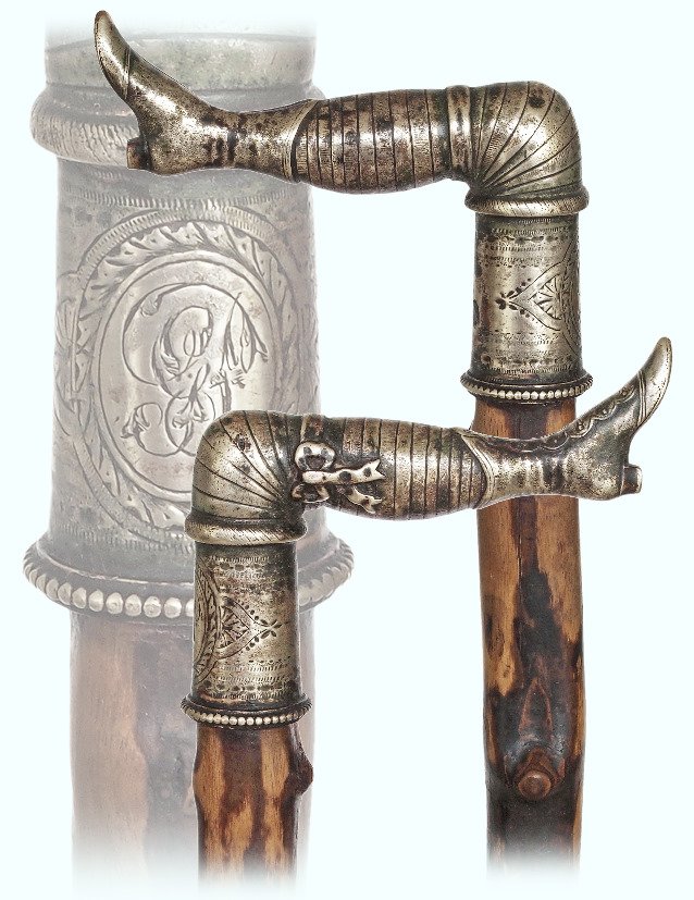 93. English Naughty Leg Cane-Ca. 1875-Victorian silver: 93. English Naughty Leg Cane-Ca. 1875-Victorian silver plated bludgeon handle, naturally knob black thorn branch shaft and a metal horn ferrule. A finely chased matching garter romances the mildly-