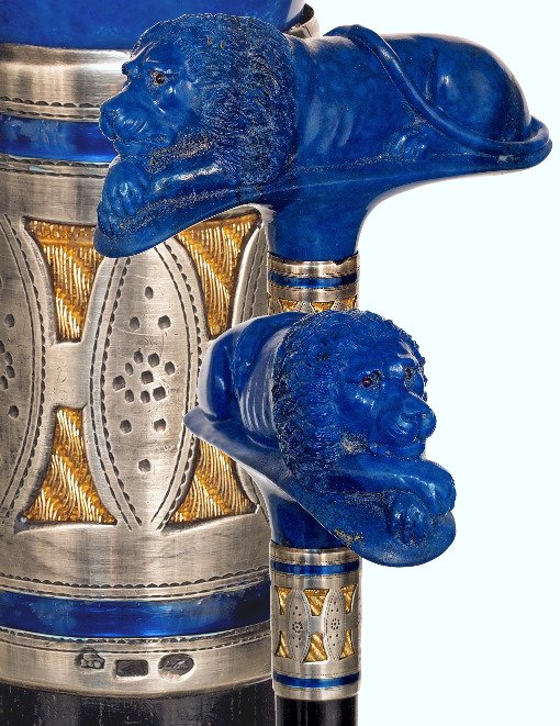 9. Lapis Lazuli Lion Dress Cane-Ca. 1900-Substantial: 9. Lapis Lazuli Lion Dress Cane-Ca. 1900-Substantial T-shaped lapis lazuli handle carved to depict a prone lion with inset red stone eyes, possibly ruby, deep black ebony shaft and a horn ferrule. The