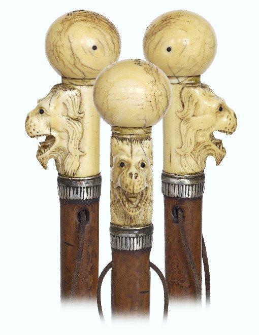 50. Early Ivory Figural Cane-Ca. 1760-Ivory ball knob: 50. Early Ivory Figural Cane-Ca. 1760-Ivory ball knob on a sizeable, vertical stem carved in very high relief with a lion face on its malacca shaft with a reeded silver collar. The fabled, gargoyle li