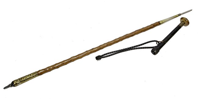 83. Makhila Weapon Cane- Ca. 1885- An original horn and: Makhila Weapon Cane- Ca. 1885- An original horn and braided leather handle with a pair on fighting pikes, knobby shaft and a pike ferrule. H- 8 ½ x 1 ¾“ O.L.- 36“ $400-$500.