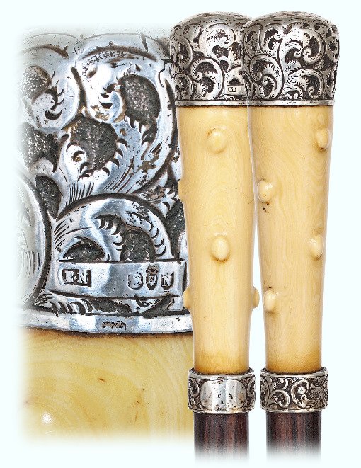 97. Ivory and Silver Dress Cane-London hallmarks: 97. Ivory and Silver Dress Cane-London hallmarks 1888-Long and tapering faux sprig ivory handle with a finely chased silver cap and matching collar, well figured Makassar ebony shaft and a metal ferru