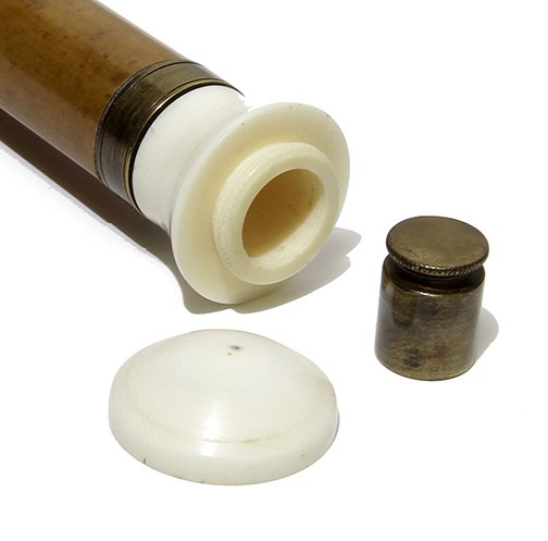 205. Ivory System Cane- Ca. 1875- The handle is an: 205. Ivory System Cane- Ca. 1875- The handle is an ivory compartment which the top unscrews to expose a brass canister probably for ink, carrying poison or owner’s favorite drug, the entire handle u