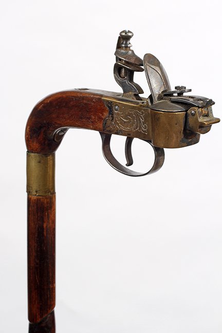 28. Cigar Lighter Cane- Ca. 1900- An unusual example of: 28. Cigar Lighter Cane- Ca. 1900- An unusual example of a fire starter flintlock mechanism which were often used as a tool of the trade in a smoking room, brass mounted working flintlock mechanism in 