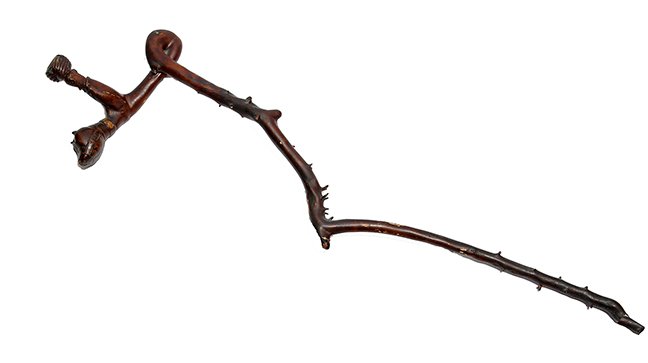 75. French “Crazy Cane” Folk Art Stick- Ca. 1820- A one: 75. French “Crazy Cane” Folk Art Stick- Ca. 1820- A one piece crazy cane with a gentleman with two color glass eyes and a turban riding what appears to be a cat or pig wearing a harness, animal ha