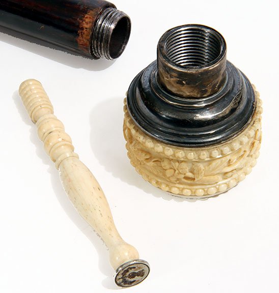 Ivory Wax Seal Cane: Ivory seal cane circa, 1870 A compartment wax seal cane with a silver monogram cartouche atop, four inch bone handle wax seal, hardwood shaft and a copper ferrule.H.-1.5" x 2.25"O.L.- 33.5