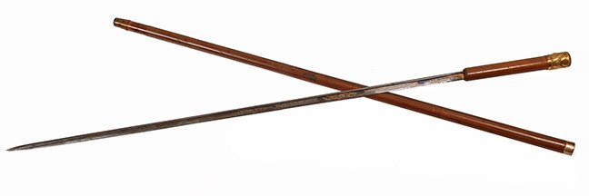 60. Formal Gold Sword Cane- Ca. 1850- A rose gold high: 60. Formal Gold Sword Cane- Ca. 1850- A rose gold high relief handle, gold collar marked L.H. and another unreadable mark, deep brown malacca shaft and a copper ferrule, 29 ½” two-sided blade with 