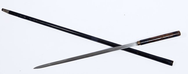 74. Japanese Sword Cane-Ca. 1890- A lacquered dragon: 74. Japanese Sword Cane-Ca. 1890- A lacquered dragon handle of which 35% is worn off, ebonized shaft, metal ferrule, 16 ½” two-sided blade with push pull mechanism. H.- 6 ¼” x 1” O.L.- 35 ¼��