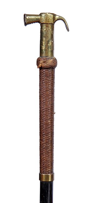100. Masonic Hammer Cane- Ca. 1900- A bell bronze: 100. Masonic Hammer Cane- Ca. 1900- A bell bronze hammer which is attributed to the Masons, leather woven upper collar, brass lower collar, ebony shaft and a brass ferrule. H.- 2 ½” x 2 ¼” O.L.-