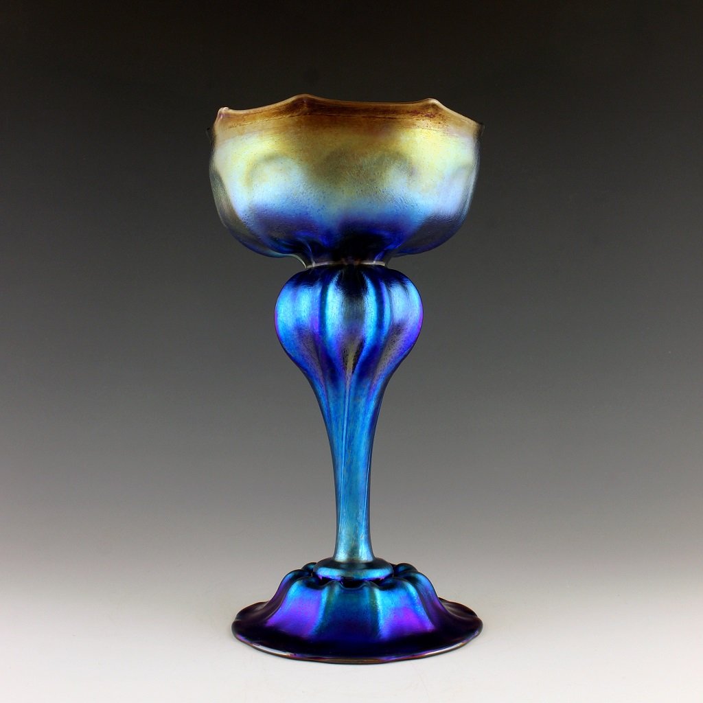 Art Nouveau Glass Vase Glamorous Tiffany or Loetz Decor: Art Nouveau Iridescent Art Glass Loetz Style Vase. This piece is a great addition to collection or a great gift. Extraordinary beautiful piece of the finest quality glass. Dimensions: Height 9 '' ( 23