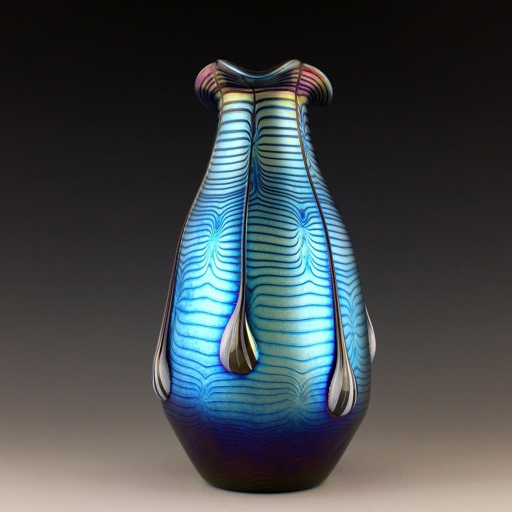 Art Nouveau Glass Vase Glamorous Tiffany or Loetz Decor: Art Nouveau Iridescent Art Glass Loetz Style Vase. This piece is a great addition to collection or a great gift. Extraordinary beautiful piece of the finest quality glass.Dimensions: Height: 10 " ( 25