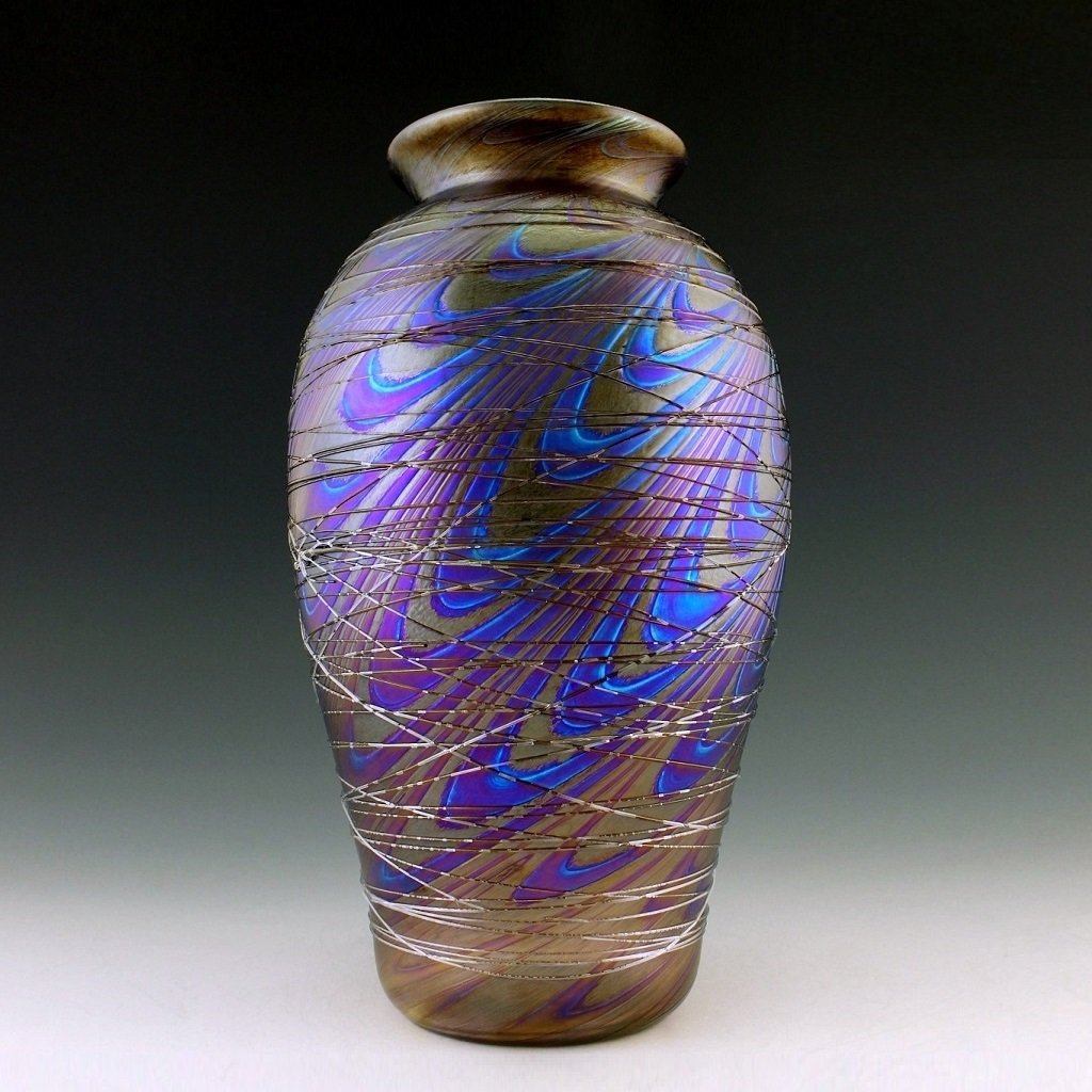 Art Nouveau Glass Vase Glamorous Tiffany or Loetz Decor: Art Nouveau Iridescent Art Glass Loetz Style Vase. This piece is a great addition to collection or a great gift. Extraordinary beautiful piece of the finest quality glass.Dimensions: Height: 10 " ( 26