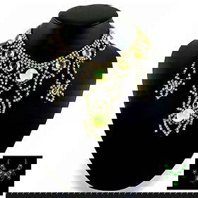 Art Deco Vaseline Uranium Glass Vintage Necklace Spider: Really nice piece that glows beautifully under UV light. All the stones in this necklace are from uranium glass. Made in Czechoslovakia. Dimensions: Measures 20" including extender and clasp. Adjustab