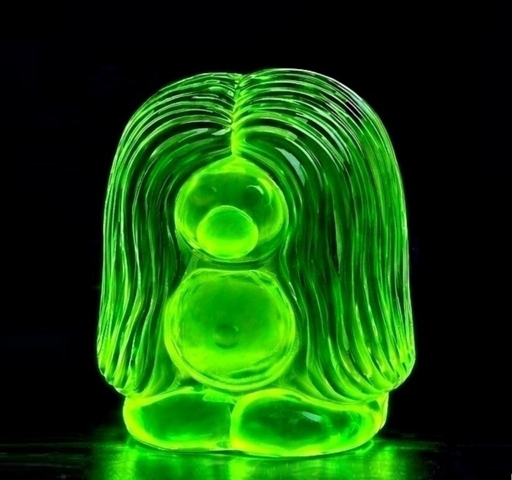 Bohemian Czech Art Deco Vaseline Uranium Glass Troll Figurine: This breathtaking piece is made of transparent Vaseline uranium glass and features a stylish Art Deco design. Its timeless elegance makes it a beautiful decorative piece for your home, office, or glas