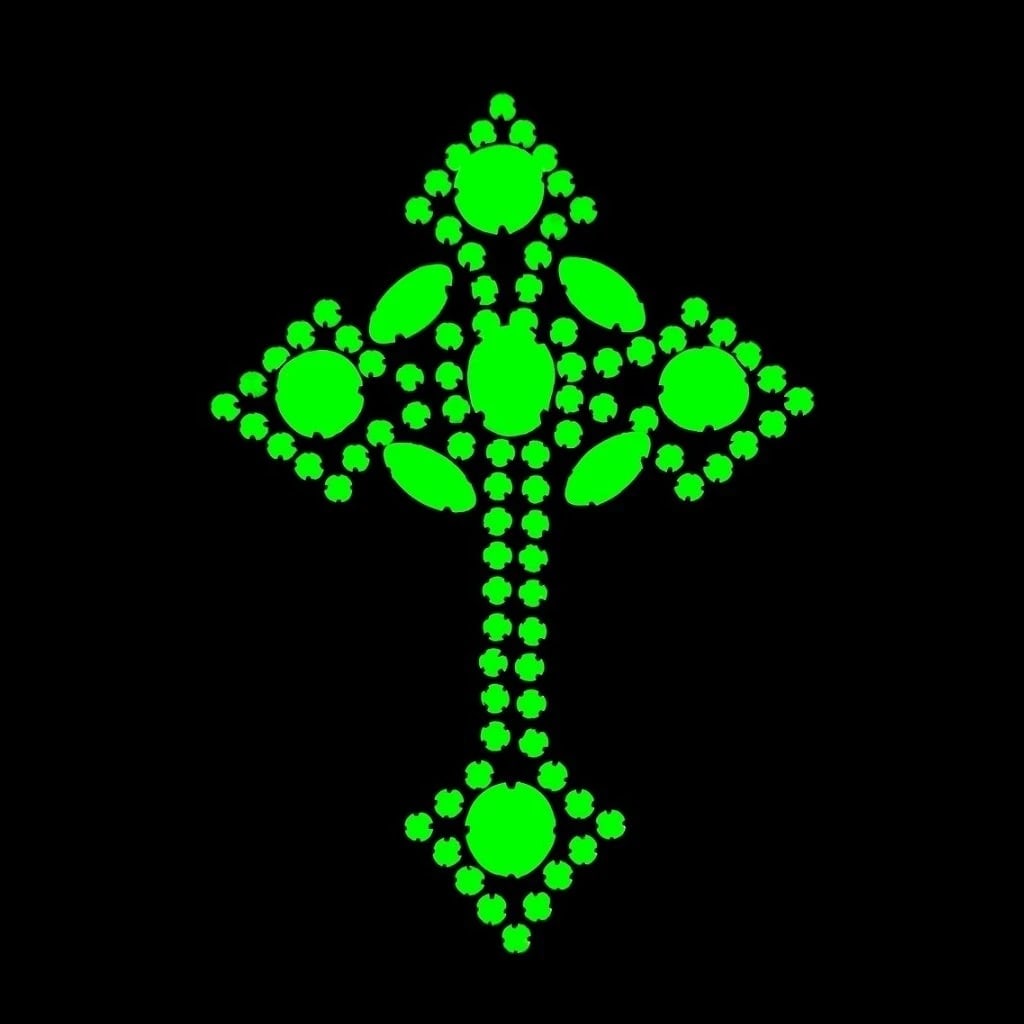 Art Deco Uranium Glass Cross Pendant: A really nice piece that glows beautifully under UV light. All the stones in this pendant are made of antique uranium glass. Made in Czechoslovakia. Height: 3 1/4 '', Width: 2 1/4 ''