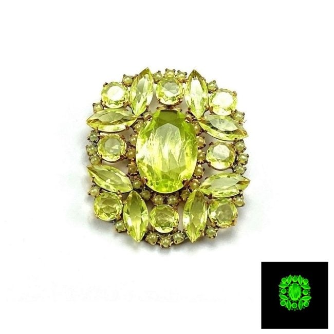 Vintage Vaseline Uranium Glass Vintage Brooch Pin: Really nice piece that glows beautifully under UV light. All the stones in this brooch are from uranium glass. Made in Czechoslovakia. Dimensions: Height 2 1/4 '', Width 2 ''