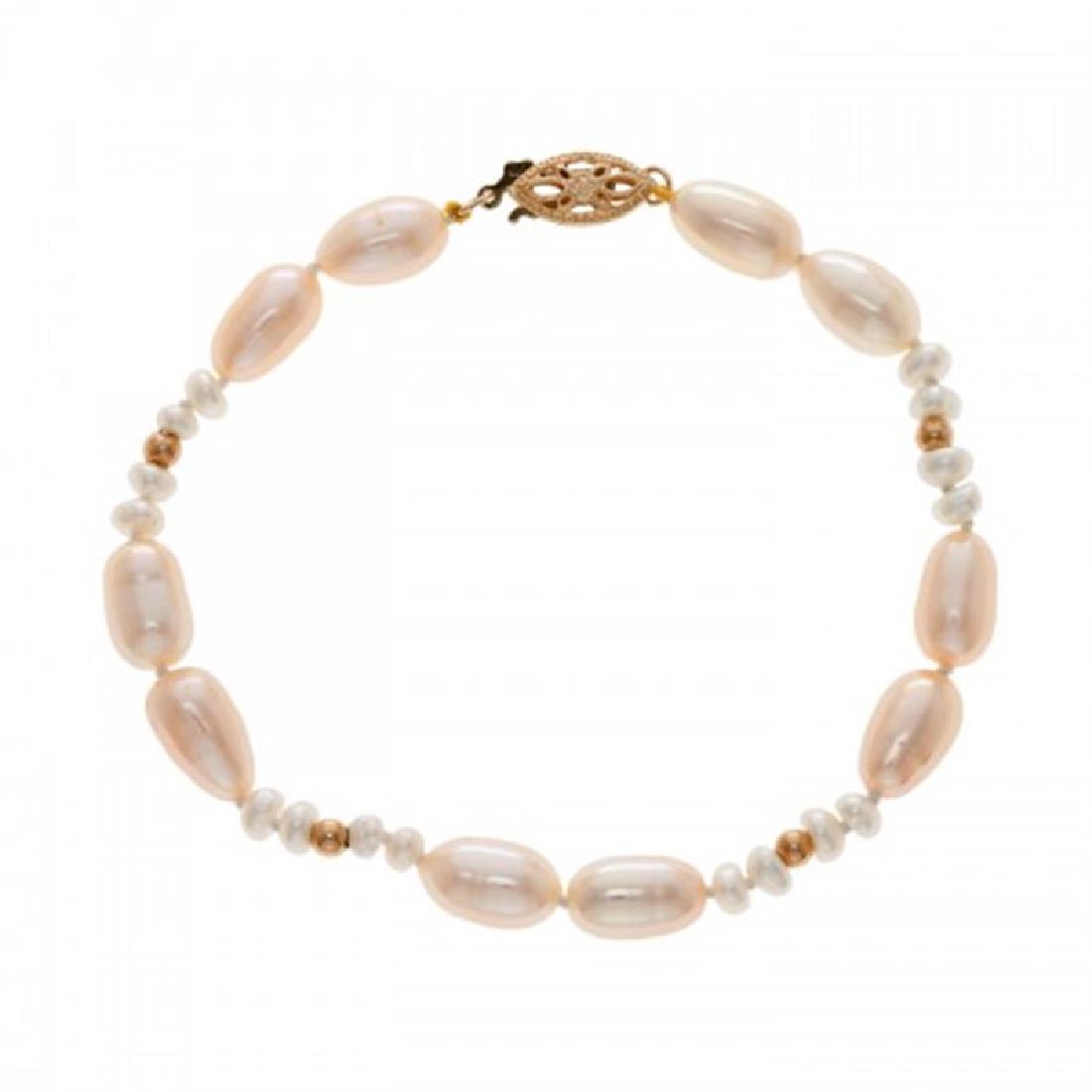 3.5-4.5mm & 6.0-6.5mm Freshwater Pearl Bracelet: 3.5-4.5mm & 6.0-6.5mm Freshwater Pearl Bracelet 3.5-4.5mm & 6.0-6.5mm Freshwater Cultured Pearl Bracelet with 14K Yellow Gold Clasp and 14K Yellow Gold Balls. 7.0 inches #FB-409