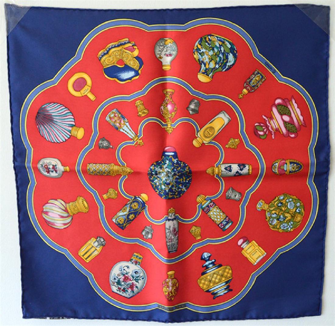 Hermes QuÃ¥Â«import Le Flacon Silk Pocket Square: AUTHENTIC HERMES silk Qu'Import le Flacon pocket square in excellent condition. Â Original silk screen design c1988 byÂ Catherine Baschet features an array of perfume bottles over a red and navy b