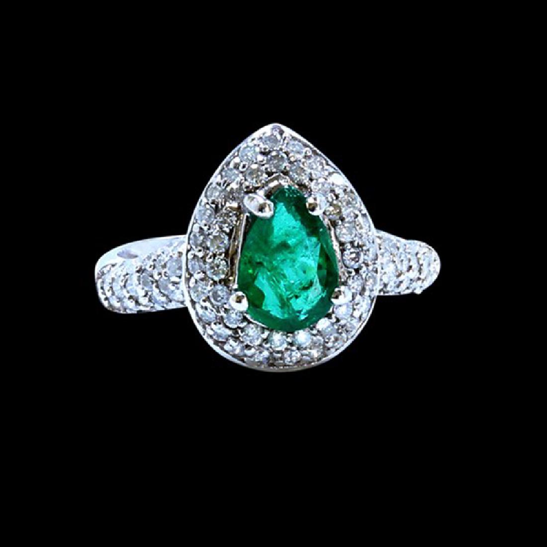 1.10CT NATURAL COLOMBIAN EMERALD 18K WHITE GOLD RING: 18K WHITE GOLD NATURAL COLOMBIAN EMERALD RING: 5.43GRAM /EMERALD: 1.10CT/ DIAMOND RD :0.83CT/#GVR1282 **This 1.10 carat pear shape natural Emerald casts a vibrant green hue. Emerald is known to help o