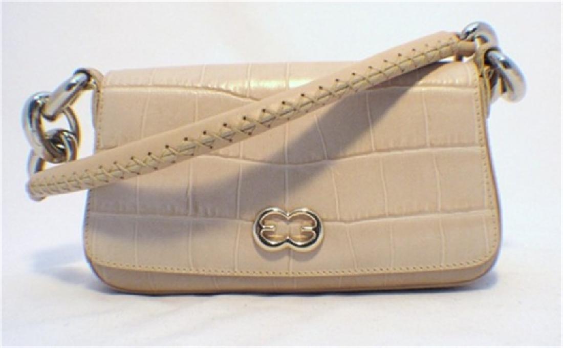 Escada Beige Embossed Alligator Handbag: This beautiful Escada handbag is the perfect accessory for every wardrobe. The exterior is in mint condition featuring beige embossed alligator leather trimmed with silver hardware. The chorded and st