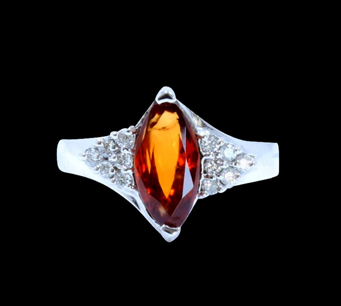2.18CT NATURAL Malaya Garnet 14K W/G RING: 14K W/G NATURAL Malaya Garnet RING :4.94GRAM /MALAYA GARNET :2.18CT/DIAMOND RD :0.21CT/#GVR1289/MALAYA GARNET IS THE VERY RARE GARNET IN THE GARNET FAMILY. VERY HARD TO FIND THIS KIND OF COLOR AND QUL