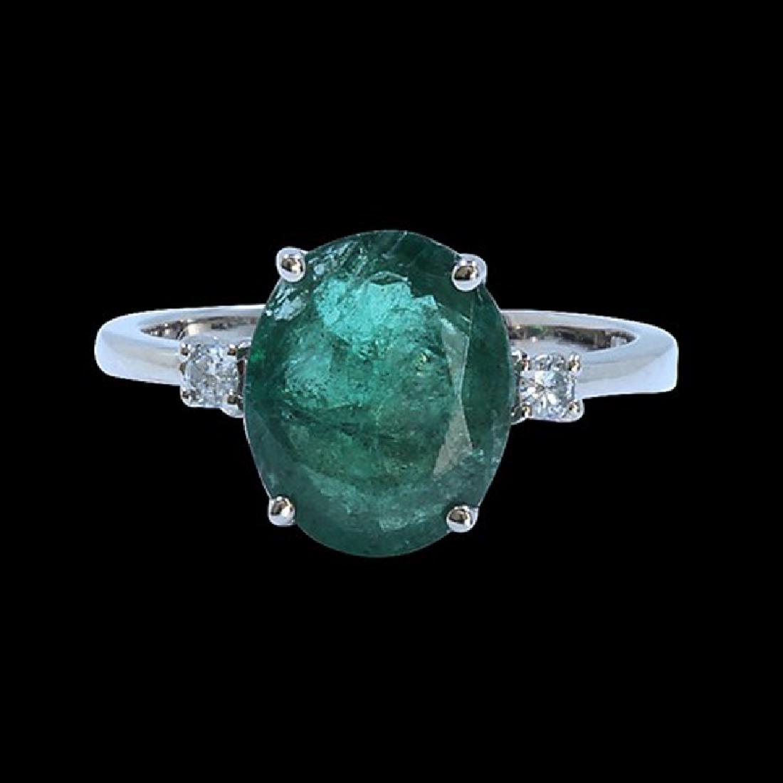 2.89CT NATURAL COLOMBIAN EMERALD 14K WHITE GOLD RING: 14KWHITE GOLD NATURAL COLOMBIAN EMERALD RING:2.12 GRAMS/COLOMBIAN EMERALD:2.89CT/ DIAMOND RD:0.08CT/#GVR1214 **This 2.89ct Oval Cut Natural Emerald catches the light and gleams like rolling hills of f