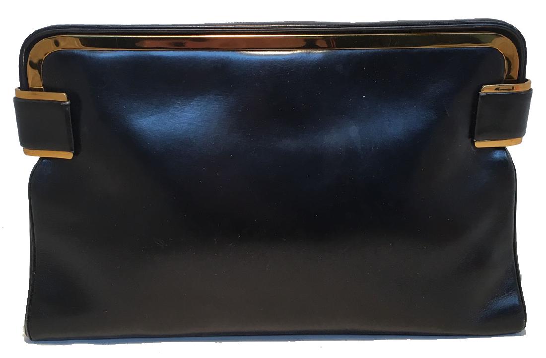 Judith Leiber Vintage Black Leather Clutch: Timeless Judith Leiber Vintage Black Leather Clutch in excellent condition. Black box calf leather exterior trimmed with gold hardware. Double side sliding latch closures open to a black silk lined in