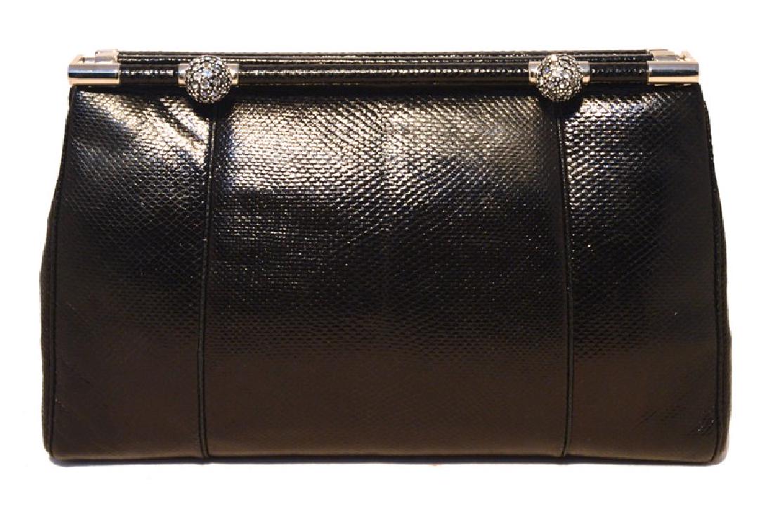 Judith Leiber Vintage Black Lizard Clutch with: BEAUTIFUL Vintage Judith Leiber black lizard clutch in excellent condition. Black lizard leather exterior trimmed with silver hardware and 2 swarovski crystal ball details. Top lifting bar closure ope