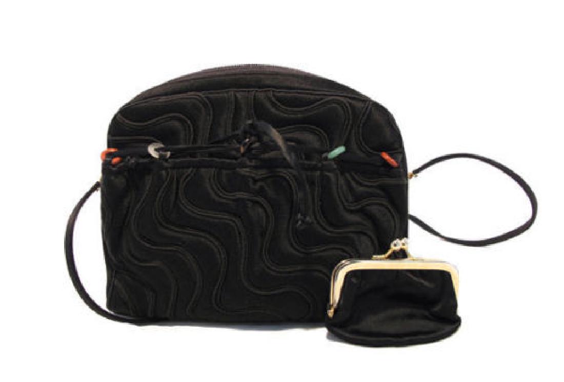 Vintage Judith Leiber for Bonwit Teller Black Silk: Beautiful vintage 1960s Judith Leiber for Bonwit Teller mini shoulder bag in excellent condition. Exterior features black satin in an embroidered wave pattern with a front slit pocket and delicate sto