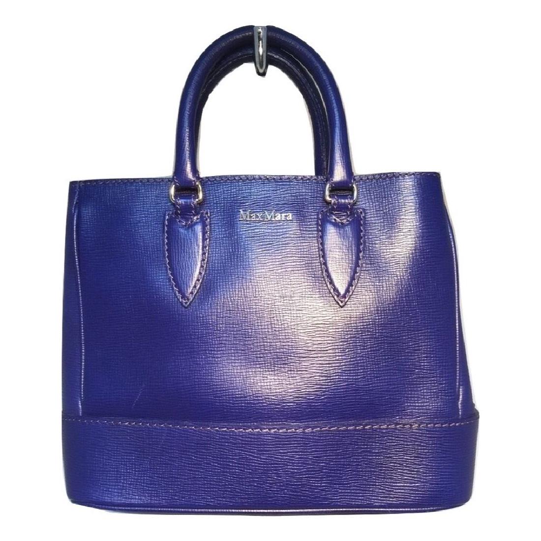 Max Mara Royal Blue Leather Handbag: Beautiful Max Mara Blue Leather Handbag with Shoulder Strap in excellent condition. Royal Blue leather exterior trimmed with silver hardware. Brown nylon lined interior with 2 storage compartments sep