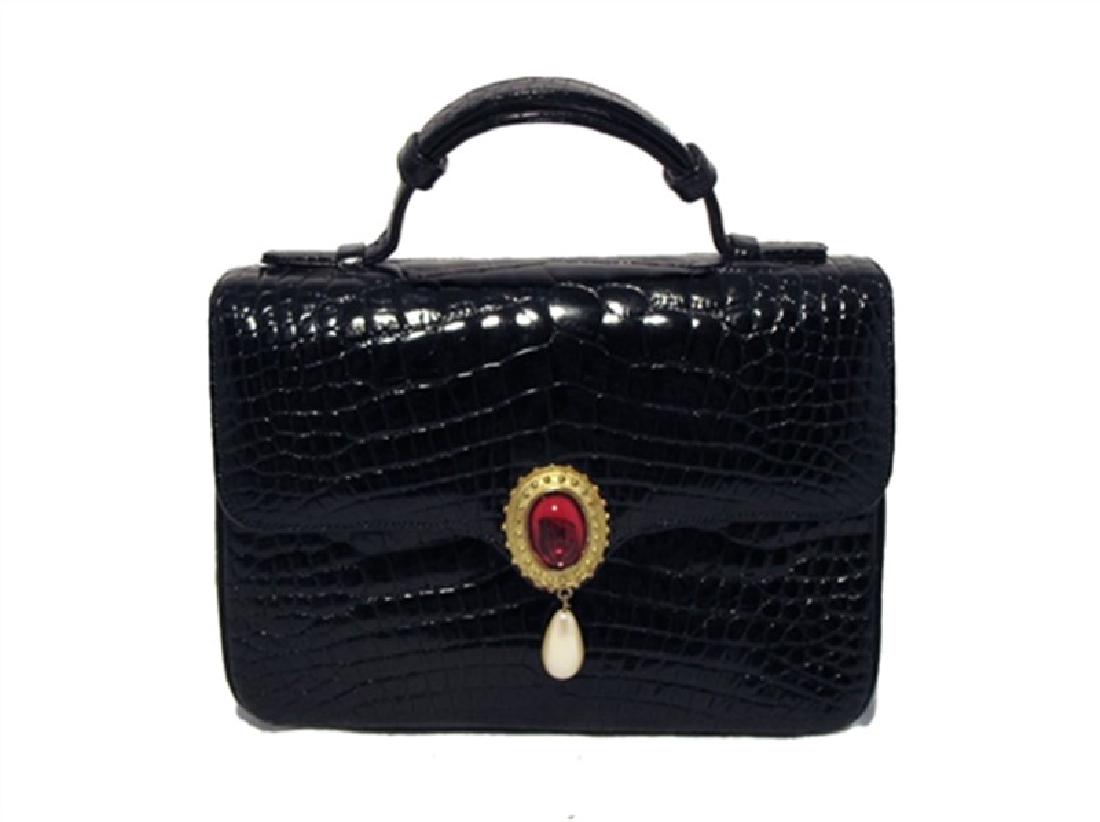 Judith Leiber Black Alligator and Pearl Mini Handbag: This gorgeous Judith Leiber piece is in excellent condition. The exterior features stunning black alligator skin trimmed with a beautiful gold pearl red stone detail along the top flap closure. The in