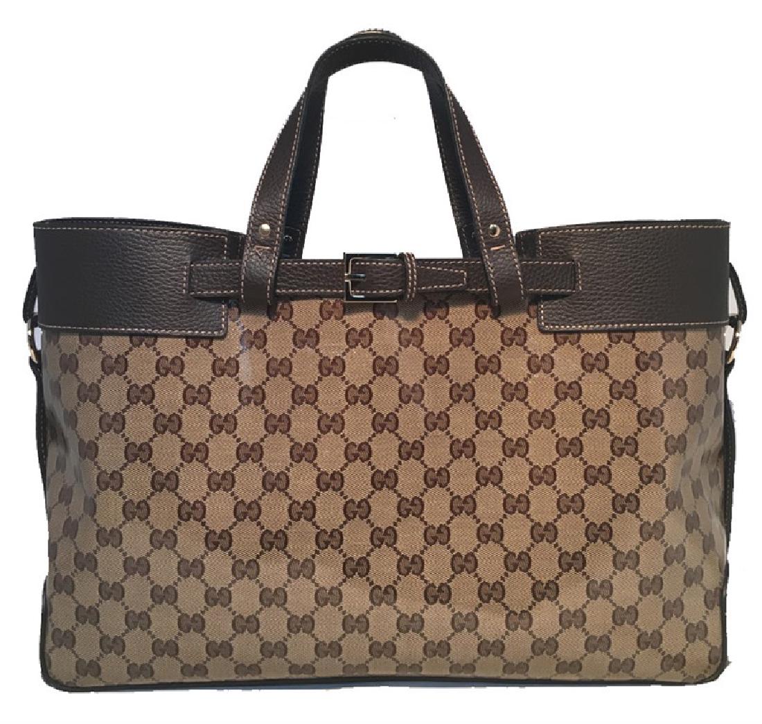 Gucci Coated Monogram and Leather Buckled Portfolio: BEAUTIFUL Gucci monogram and leather portfolio tote in excellent condition. Coated monogram canvas trimmed with dark brown leather and silver hardware. Buckle details on both exterior top sides. Brown