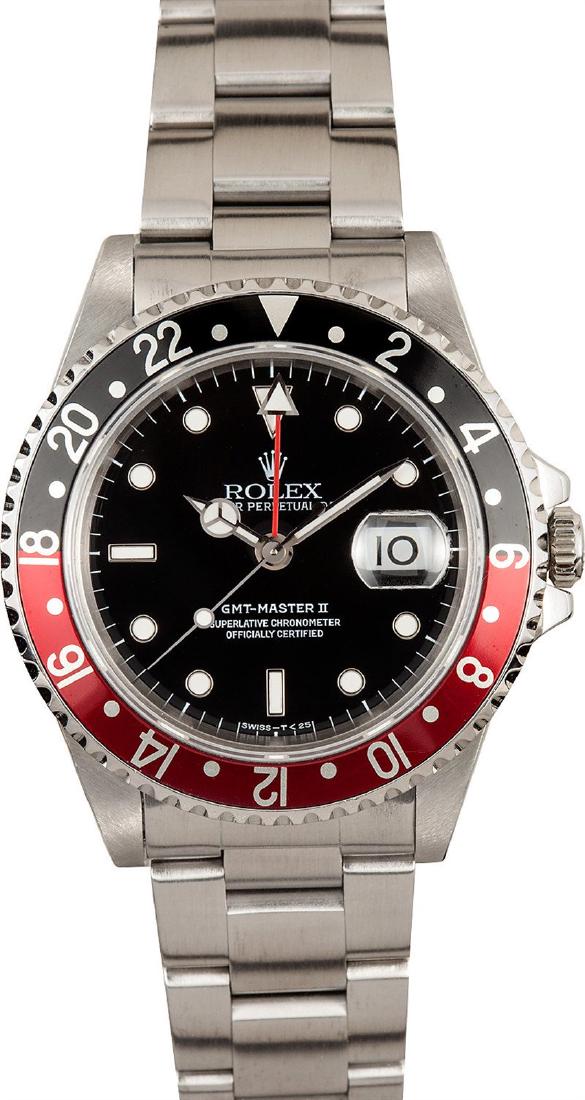 Pre-owned GMT-Master: Model/Style-GMT-Master II 16710 Features-Automatic movement w/ date, Quickset, scratch resistant sapphire crystal Case-Stainless steel with red and black "coke" insert (40mm) Bracelet-Stainless steel