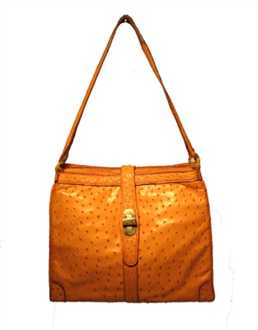 Vintage Mark Cross Tan Ostrich Shoulder Bag: This rare Mark Cross shoulder bag is in excellent vintage condition. The exterior features stunning tan ostrich leather trimmed with gold hardware. Three separate storage compartments provide ample sp