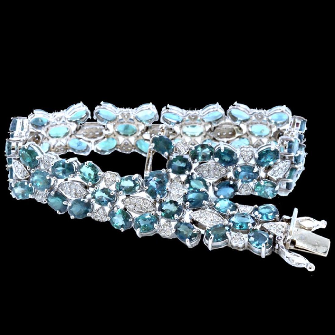 15.93CT NATURAL ALEXANDRITE 14K WHITE GOLD BRACELET: 14K WHITE GOLD NATURAL ALEXANDRITE BRACELET:22.42GRAMS/DIAMOND:2.29CT/ALEXANDRITE:15.93CT/#GVB1175 **Stately 15.93ct Oval Cut Natural Alexandrite is a twinkling halo of green, artfully set in 14k whit