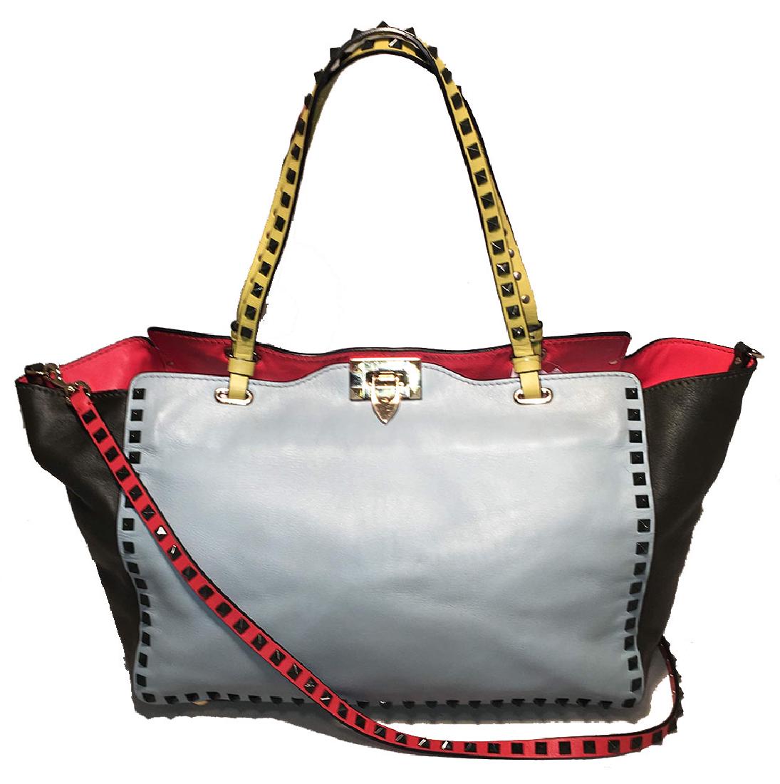 Valentino Garavani Studded Multicolor Leather Rockstud: Valentino Garavani Studded Multicolor Leather Rockstud Tote Bag in excellent condition. Multicolor leather exterior with gold hardware and gunmetal studs along edges and shoulder strap. Red, baby blue