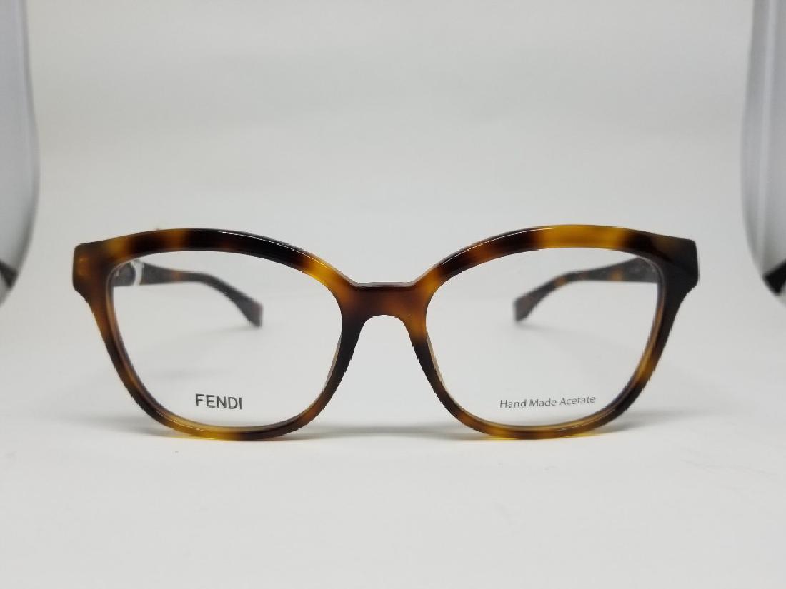 FENDI Glasses Frames - / (P1589FG215N22): FENDI Glasses Frames - / (P1589FG215N22) Brand : FENDI Serial : FF 0044 QHD11B1XVF Condition : Brand New SIze : 140 Come With : Plastic zipper bag , Glasses #RK294