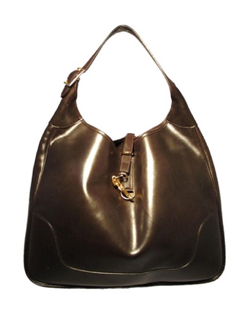 Vintage Hermes Brown Leather Shoulder Bag: This wonderful vintage Hermes find is in very good condition. The beautiful brown leather exterior is trimmed with gold hardware. The unique latch closure opens to an unlined interior with plenty of s
