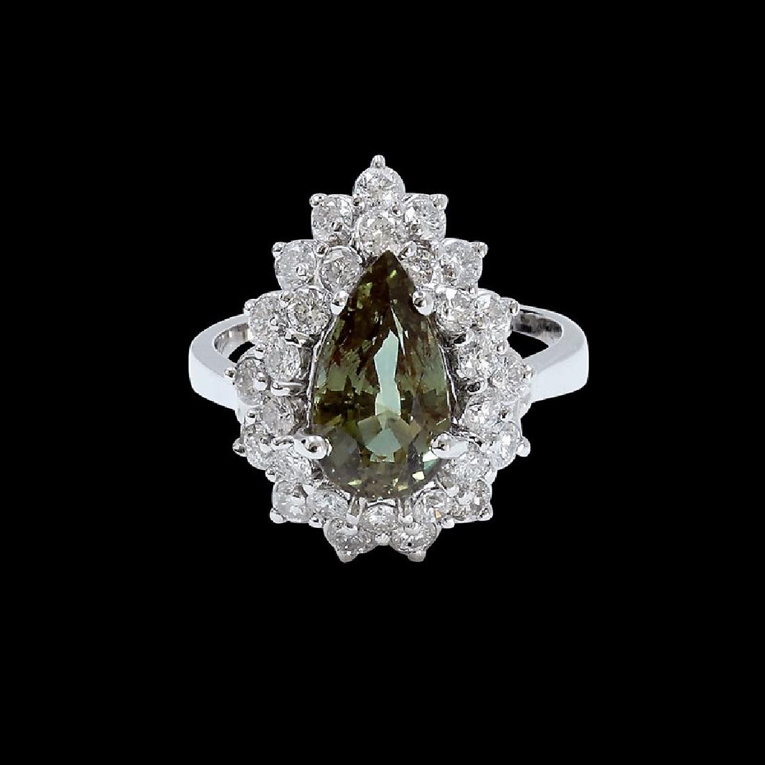 3.11ct Alexandrite 18K White Gold Ring: 18K WHITE GOLD ALEXANDRITE RING : 5.72 GRAMS / DIAMOND : 1.24CT / ALEXANDRITE : 3.11CT / #GVR1016 **This 3.11ct pear shape natural Alexandrite, one of the world's rarest gemstones, catches the light w