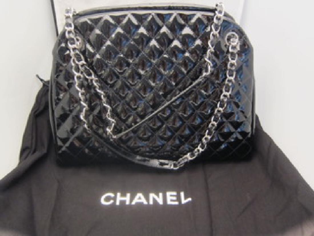 Chanel Just Mademoiselle Maxi Bowling Bag: Chanel Just Mademoiselle Maxi Bowling Bag in black patent leather. This bag looks brand new; no creasing, no scratches, no marks at all. Worn one time and stored in the dust bag and box since. Box, du